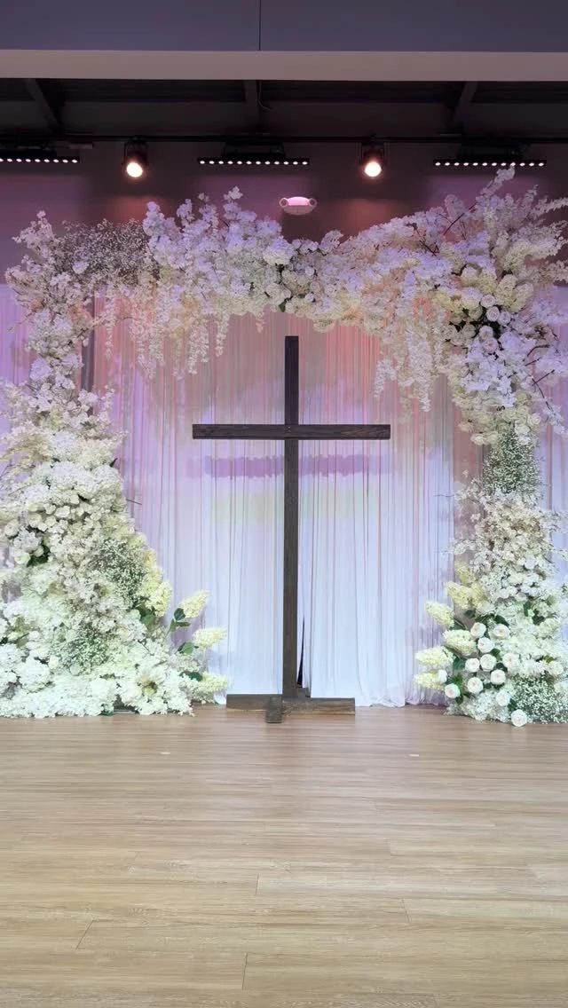 Junis wedding ceremony with a floral arch